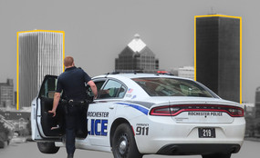 A collage of a Rochester police car overlayed on the Rochester skyline.