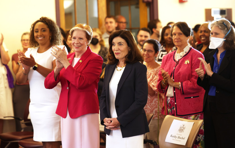 DOL Commissioner Roberta Reardon (red jacket, left) with Governor Kathy Hochul at a Women's Equality Day event in Albany on August 26, 2022.