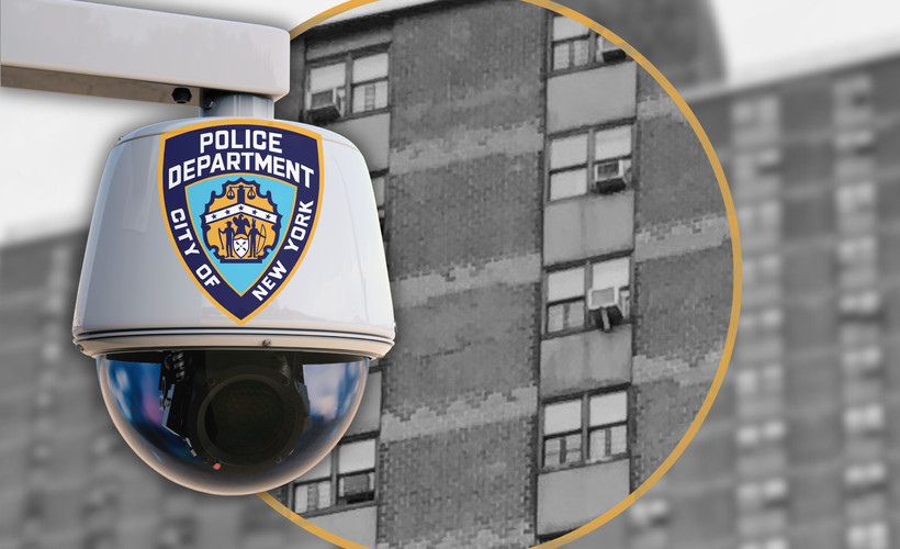 A NYPD camera set against a public housing building