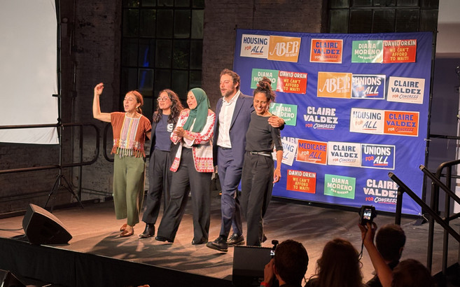 Winning DSA candidates at a watch party