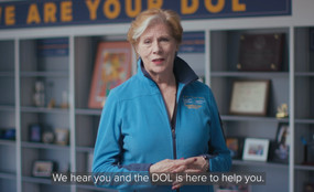 A video still of Labor Commissioner Roberta Reardon with a caption reading, "We hear you and the DOL is here to help you."