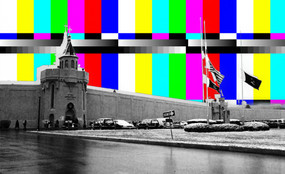 Attica Correctional facility exterior in grayscale, with bright TV static behind.