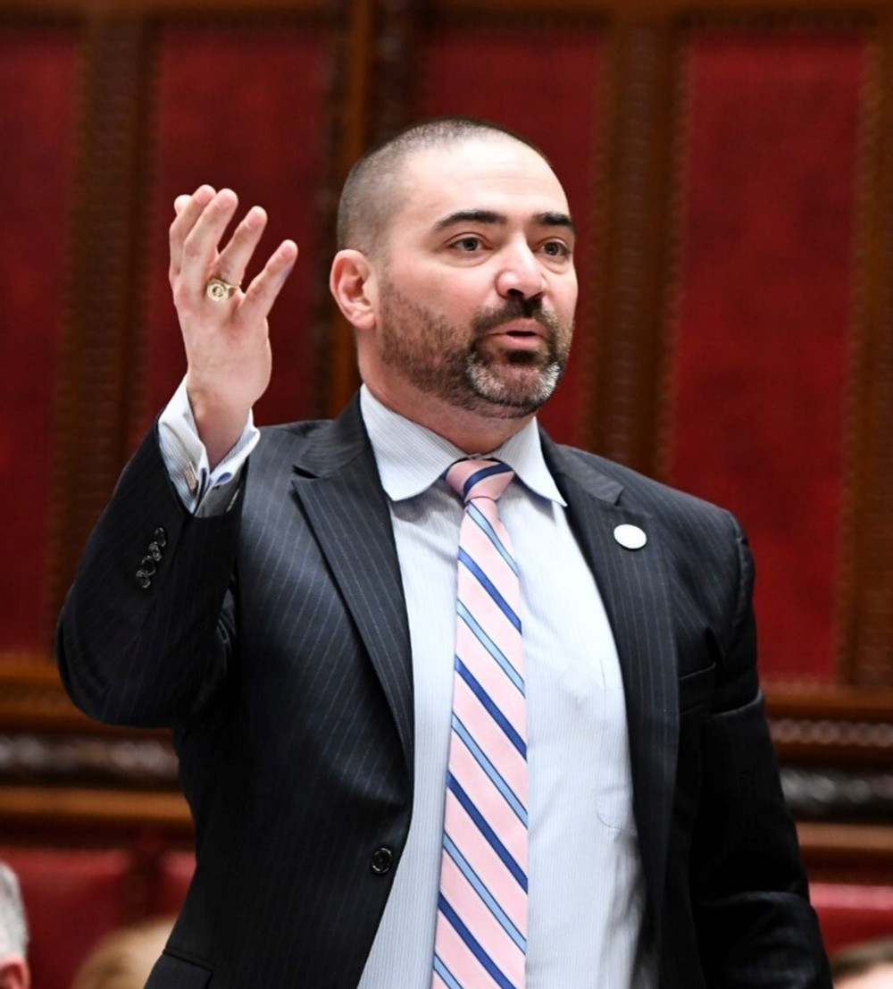 Fred Akshar stands on NY Senate floor and speaks in April 2019.