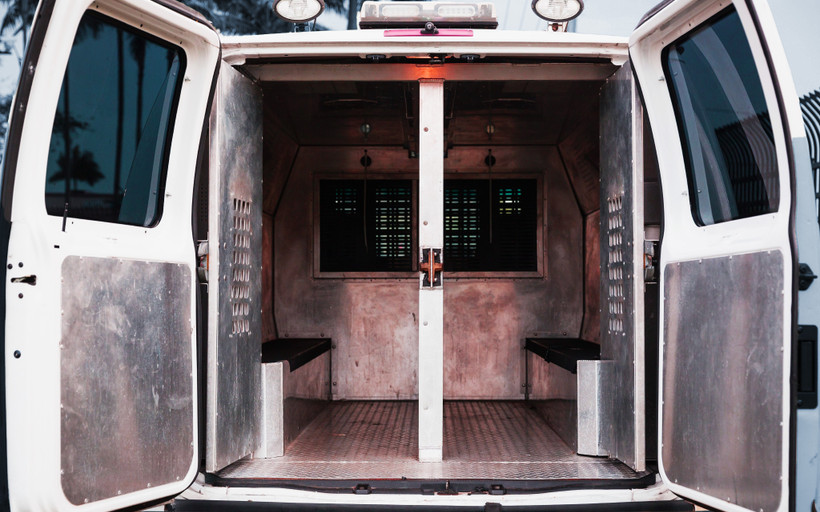 The back of an open prison transport van