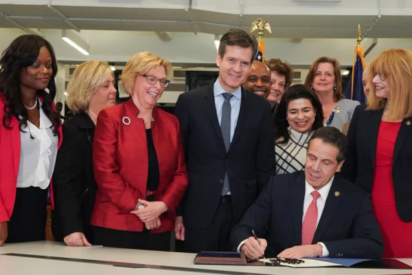 Governor Cuomo signing a bill