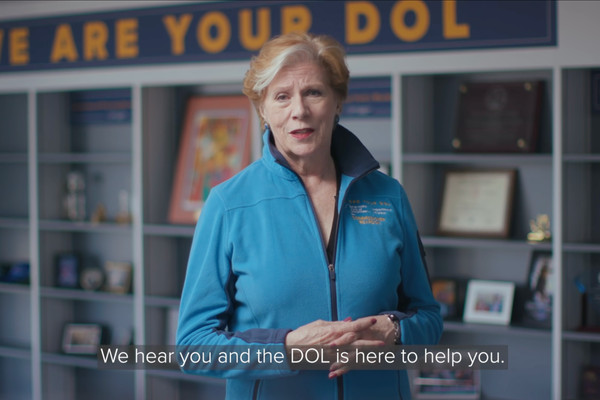 A video still of Labor Commissioner Roberta Reardon with a caption reading, "We hear you and the DOL is here to help you."