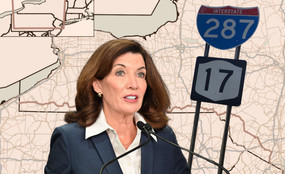 Kathy Hochul in front of a map of New York Route 17.