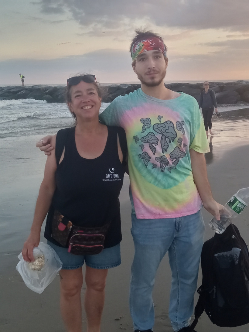 Kate Dessommes and her son, Dylan Marino, on a beach