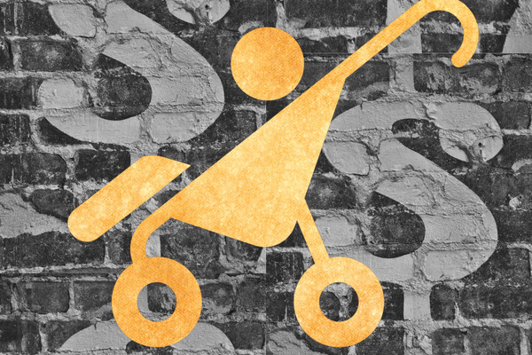 The logo of a baby in a stroller lays above a background of dollar signs on bricks.