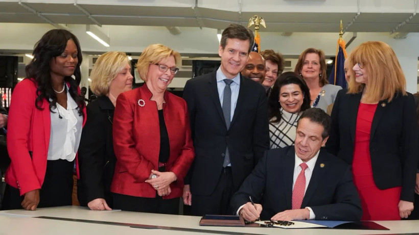 Governor Cuomo signing a bill