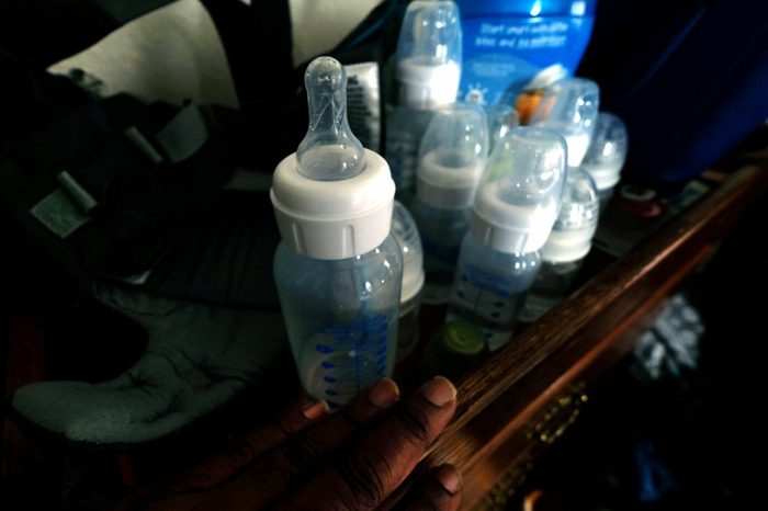Baby bottles close to each other on a small personal desk