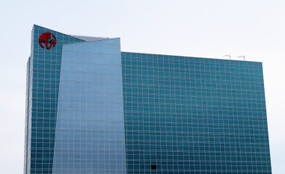 Resorts World Catskills casino in front of a bright, gray sky
