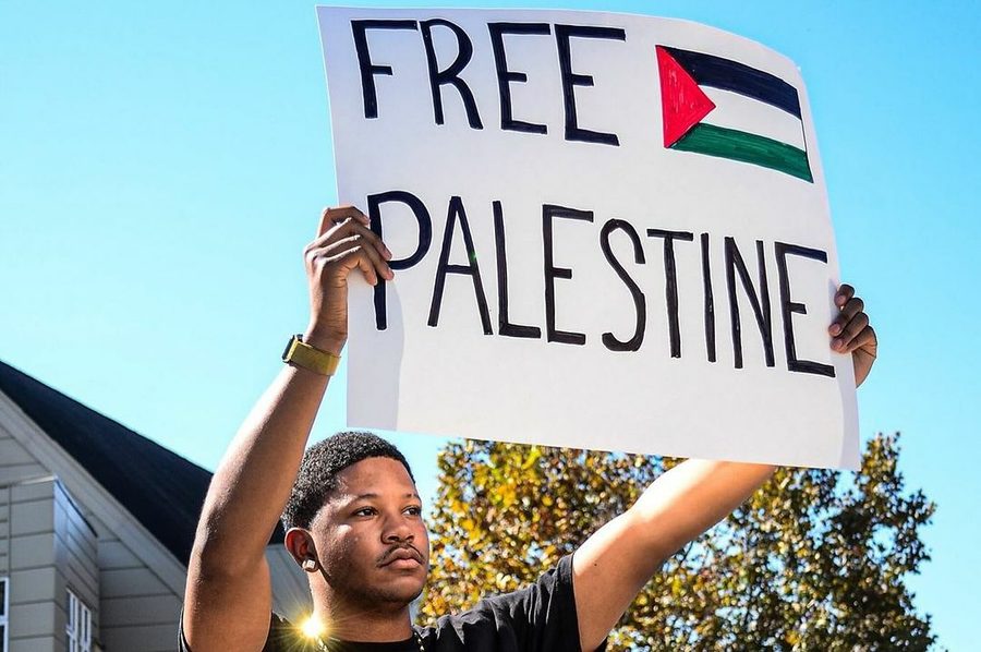 "Free Palestine" sign held up by young Black student