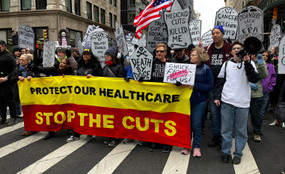 Marchers in lower Manhattan stage a "die-in" on March 15 to protest proposed cuts to Medicaid.