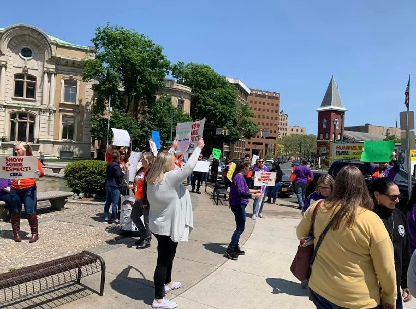 Photo of benefit workers' protest outside their office building in Syracuse