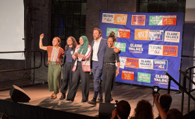Winning DSA candidates at a watch party