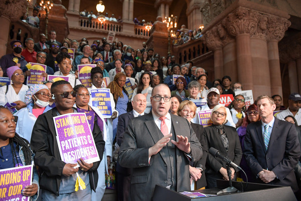 State Senator Gustavo Rivera, a major opponent of Hochul's cuts to Health Homes, speaks at a rally for health workers on April 17, 2023.