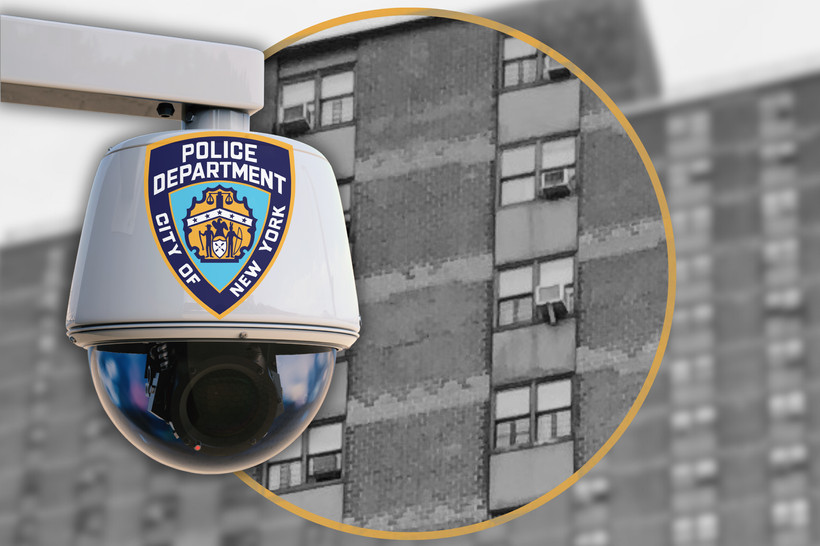 A NYPD camera set against a public housing building