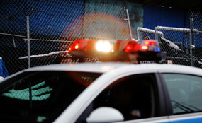 A cop car is flashing its lights.