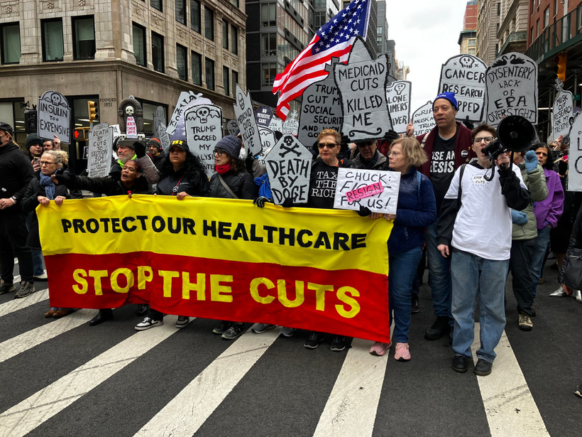 Marchers in lower Manhattan stage a "die-in" on March 15 to protest proposed cuts to Medicaid.