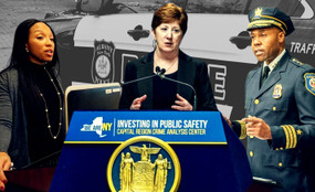 CCRB chair Nairobi Vives, Mayor Kathy Sheehan, and Police Chief Eric Hawkins against a police car
