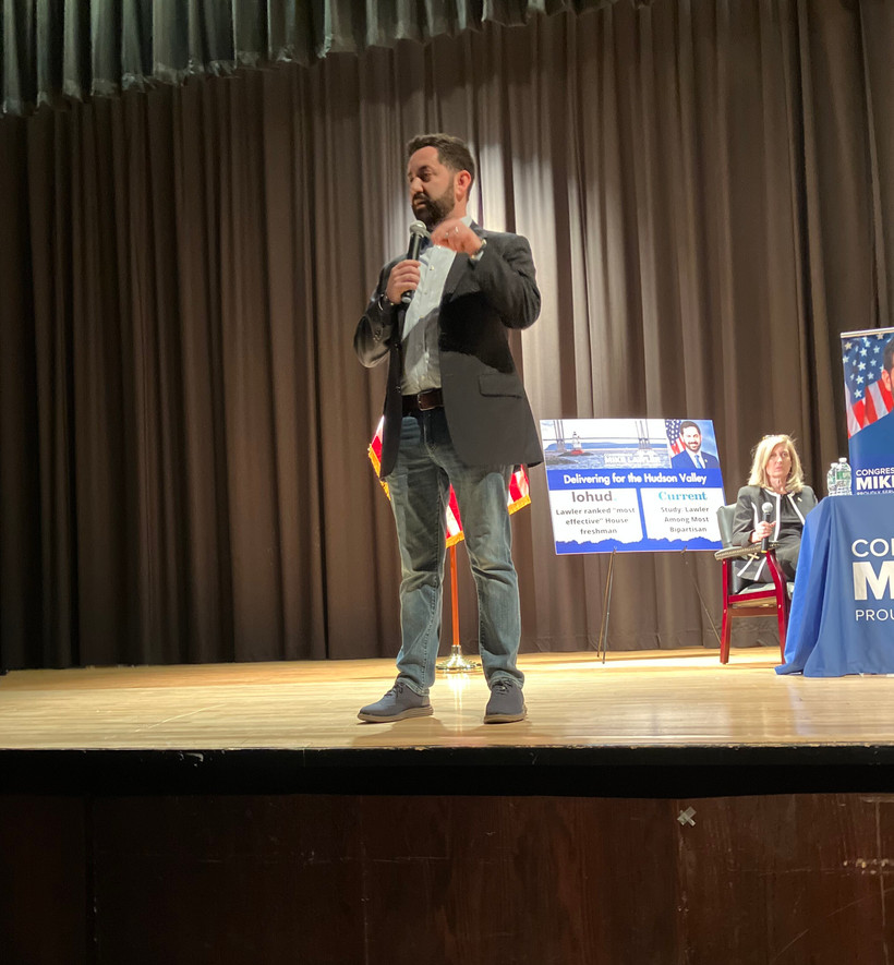 Rep. Mike Lawler tells a hostile crowd at Clarkstown South High School in West Nyack on April 27 that budget cuts are necessary, but he'll protect Medicaid for the most vulnerable.