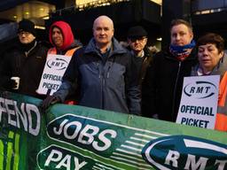 Mick Lynch, general secretary of the Rail, Maritime, and Transport Workers union, stands on a picket line in London, England.