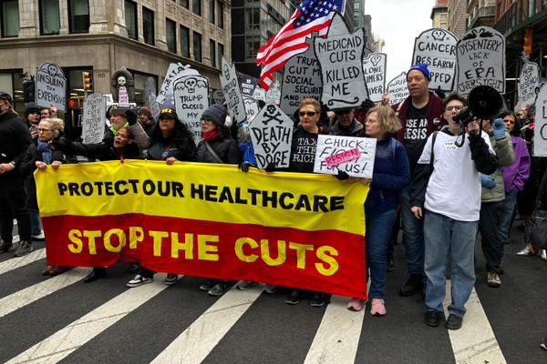 Marchers in lower Manhattan stage a "die-in" on March 15 to protest proposed cuts to Medicaid.
