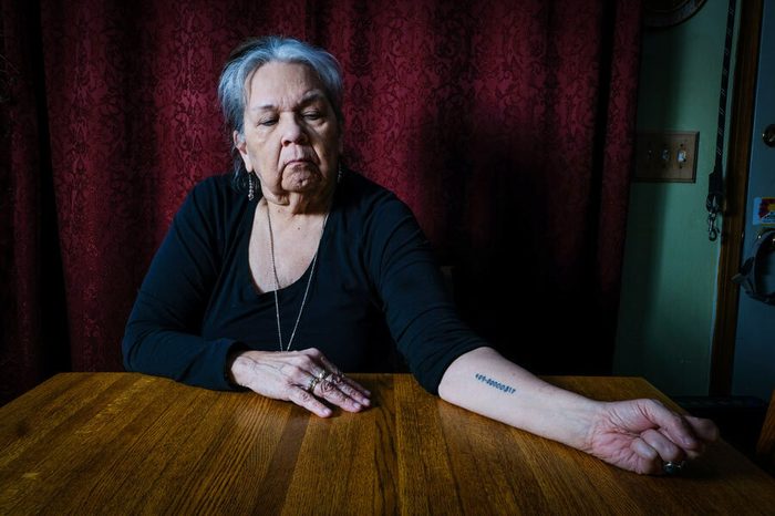 Jody Beaulieu, 70, displays a tattoo of her tribal enrollment number