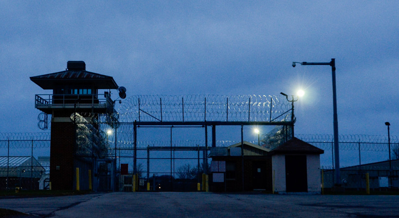 A view of the entrance gate of Attica Correctional Facility in New York, at dusk.