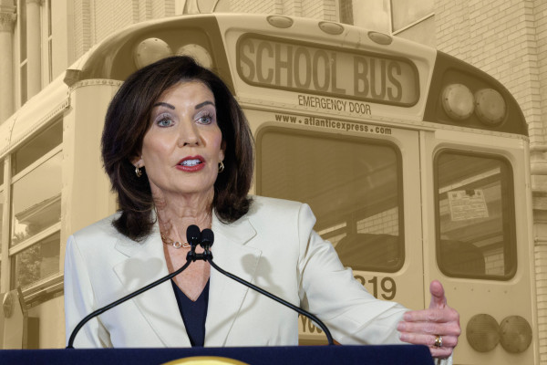 A photo collage of Governor Kathy Hochul in the foreground, with a yellow-tinted photo of a school bus in the background.