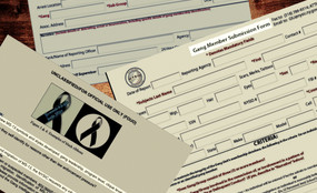 Three NYSIC gang member identification documents appear scattered on a desk.