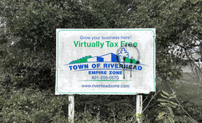 Sign reads:
Grow your business here! 
Town of Riverhead Empire Zone 
631-208-0570
www.riverheadzone.com