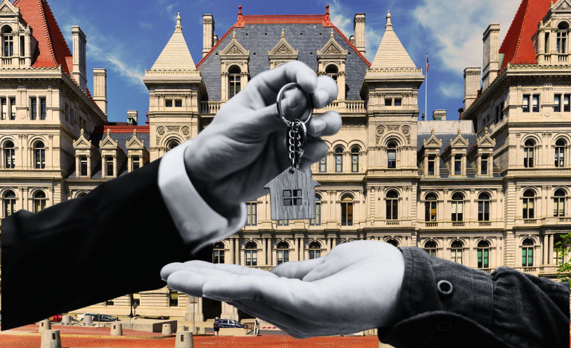 Landlord handing off the keys in front of the New York State Capitol