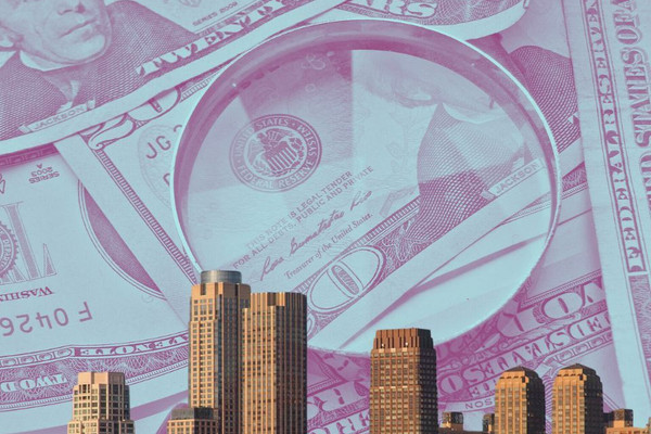 An image shows a closeup of a magnifying glass and $20 bills behind the Bronx skyline.