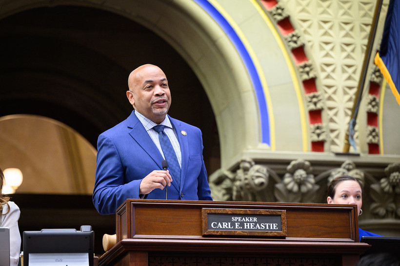 A photo of Assembly Speaker Carl Heastie walking towards the camera while looking off to the side.