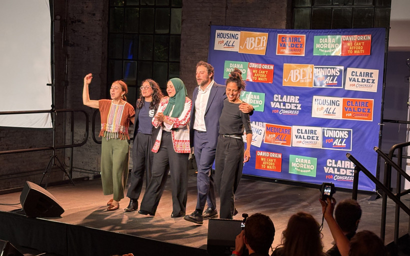 Winning DSA candidates at a watch party