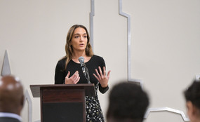 State Senator Julia Salazar speaks at a podium.