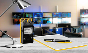 Photo collage of a desk with a notepad and voice recorder in a newsroom.