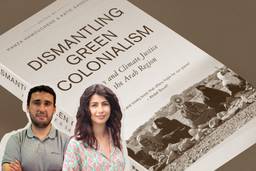 The cover of a book reads, “Dismantling Green Colonialism: Energy and Climate Justice in the Arab Region.” At the bottom of the cover, there’s a picture of women sitting down in a desert, one of them holding a megaphone. In front of the book, there’s a picture of Hamza Hamouchene with his arms crossed and of Manal Shqair smiling.