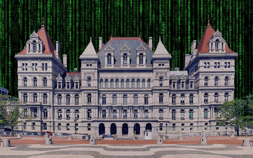 The New York state Capitol against a wall of code