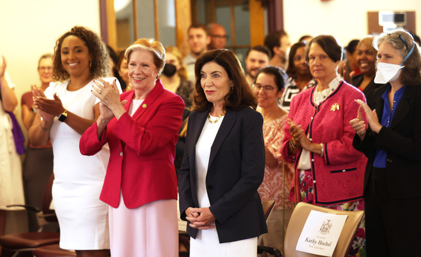 DOL Commissioner Roberta Reardon (red jacket, left) with Governor Kathy Hochul at a Women's Equality Day event in Albany on August 26, 2022.