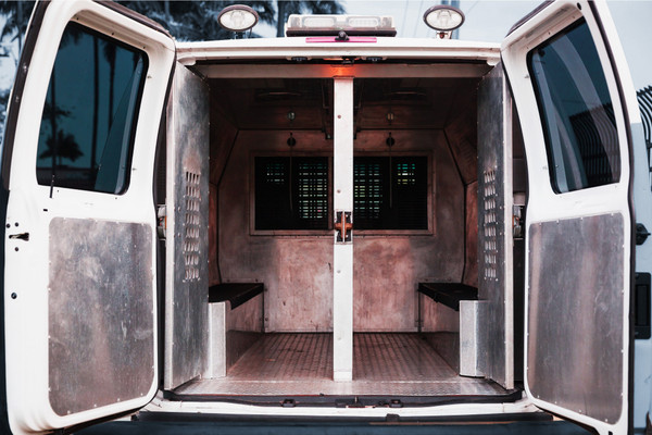 The back of an open prison transport van