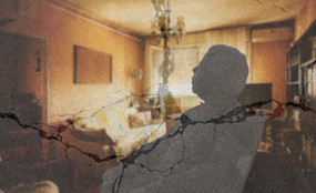 A silhouette of an elderly person sitting alone in a chair in a warm living room. Cracks appear over the image, indicating precarity.