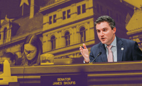 New York Senator James Skoufis is shown sitting down and speaking into a microphone during a legislative hearing.