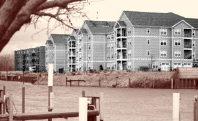 Gray poster-style houses over a sepia landscape.