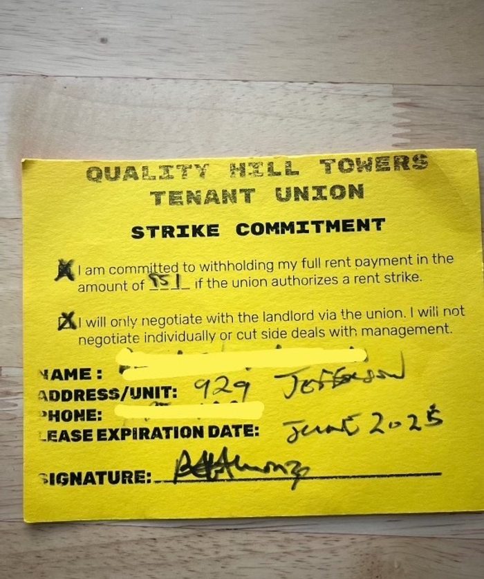 A signed yellow card reads "Quality Hill Towers Tenant Union Strike Commitment - I am committed to withholding my whole rent of $951 if the union authorizes a rent strike. I will only negotiate with the landlord via the union."﻿