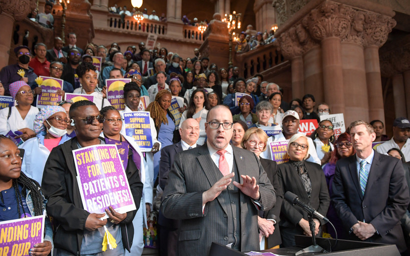 State Senator Gustavo Rivera, a major opponent of Hochul's cuts to Health Homes, speaks at a rally for health workers on April 17, 2023.