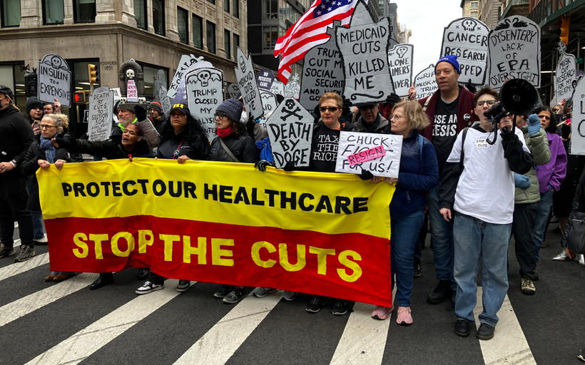 Marchers in lower Manhattan stage a "die-in" on March 15 to protest proposed cuts to Medicaid.