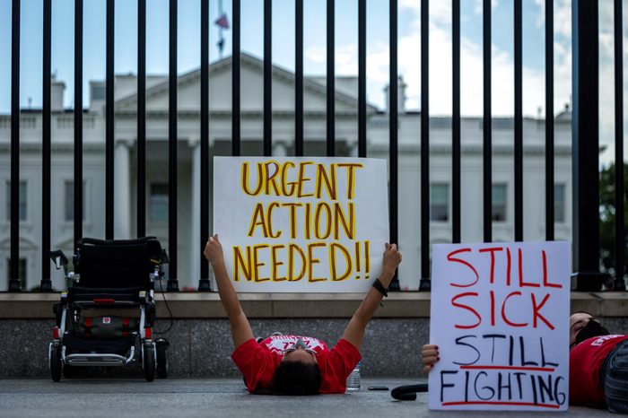 Activists with the #MEAction Network, which organizes around health equity for complex chronic diseases (such as long Covid), demand attention from the White House Sept. 19, 2022, an echo of the “die-ins” held by ACT UP protesters for recognition of the AIDS crisis.